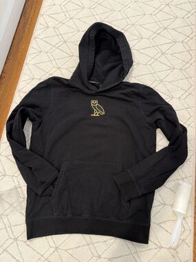 Ovo Black Hoodie with Small Gold Owl Logo